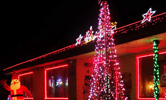 The display as seen from the side street, with red, green and white lights